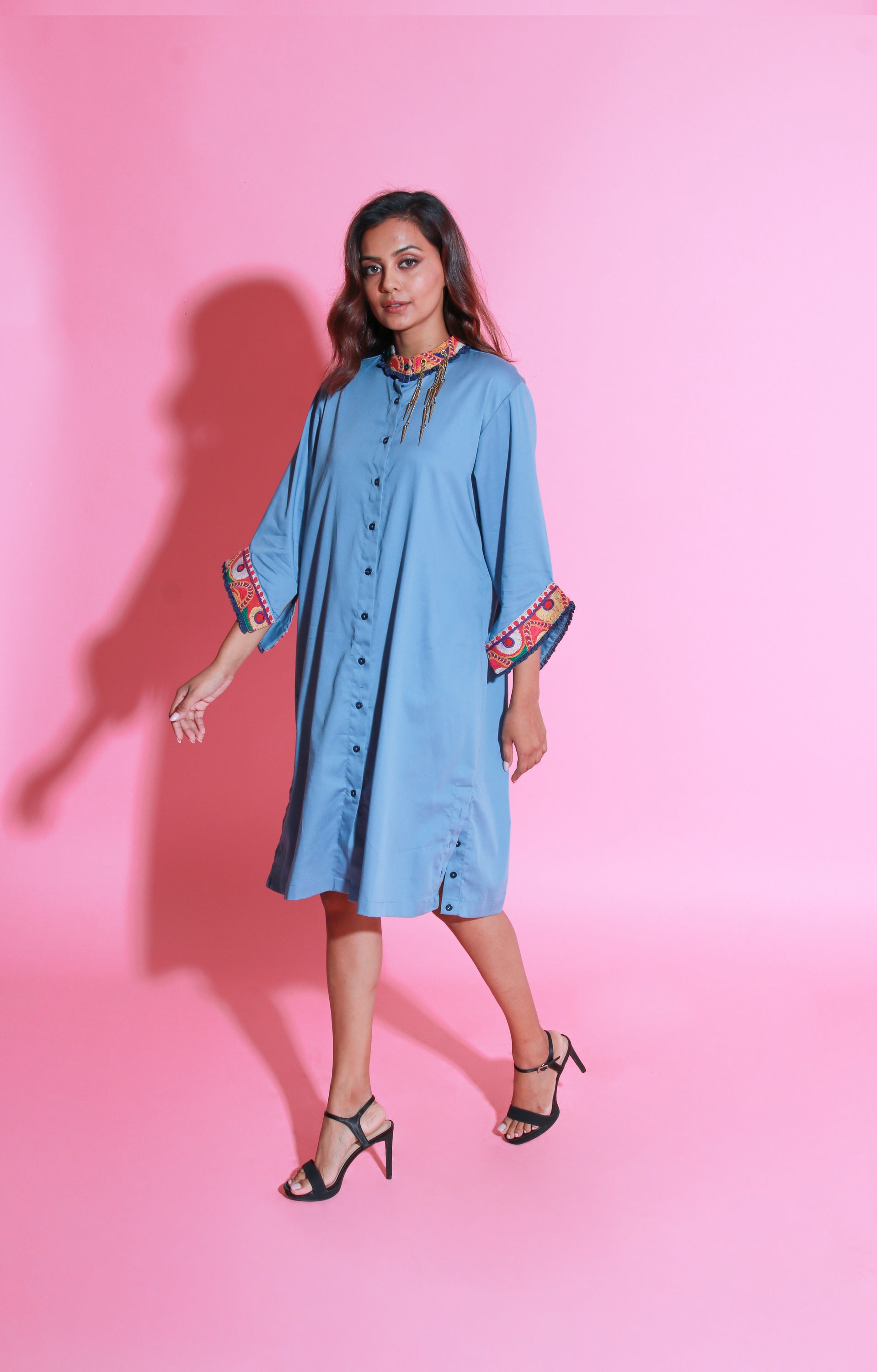 Slate blue shirt dress with Kutch border and a mandarin collar with side buttons slit.