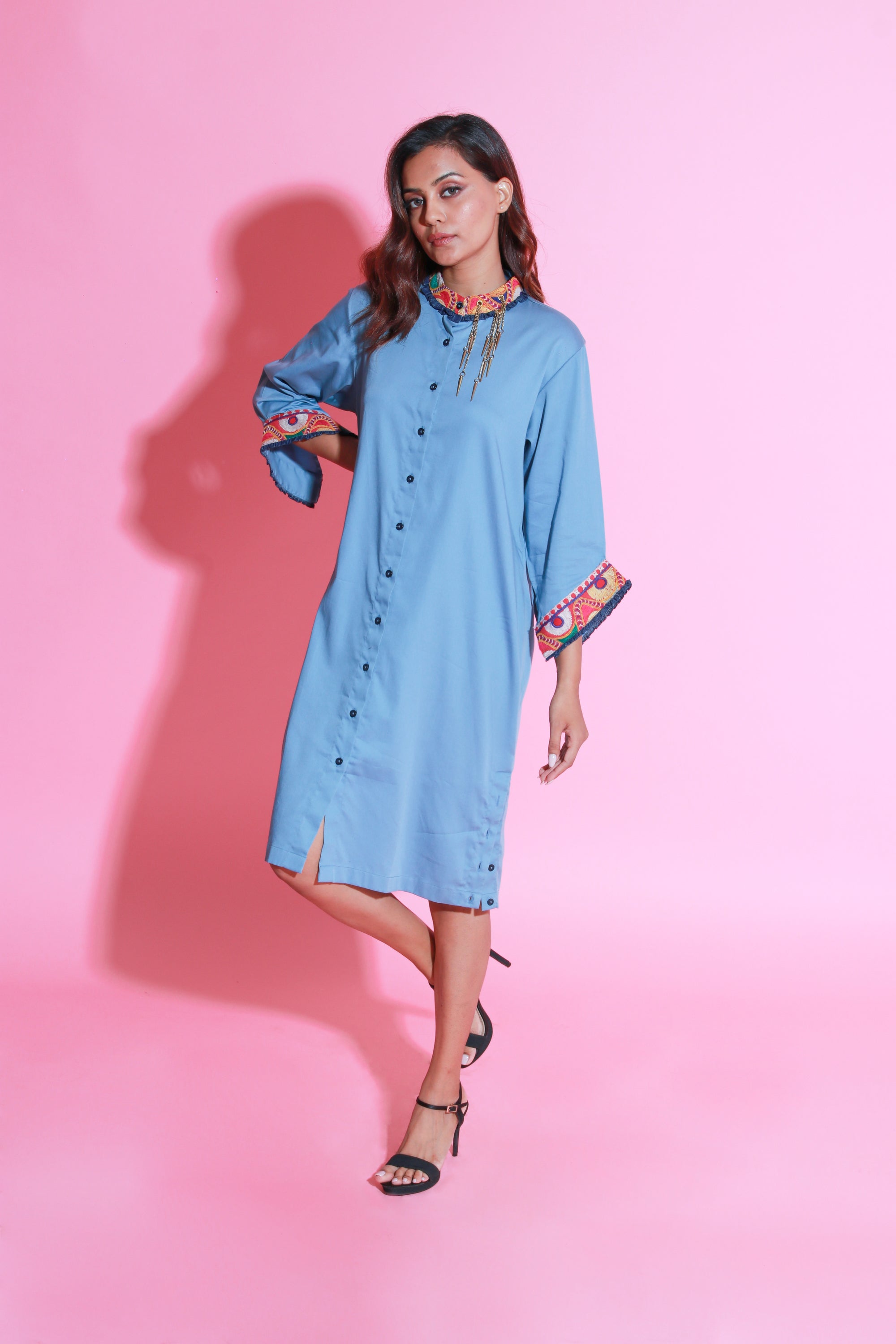 Slate blue shirt dress with Kutch border and a mandarin collar with side buttons slit.