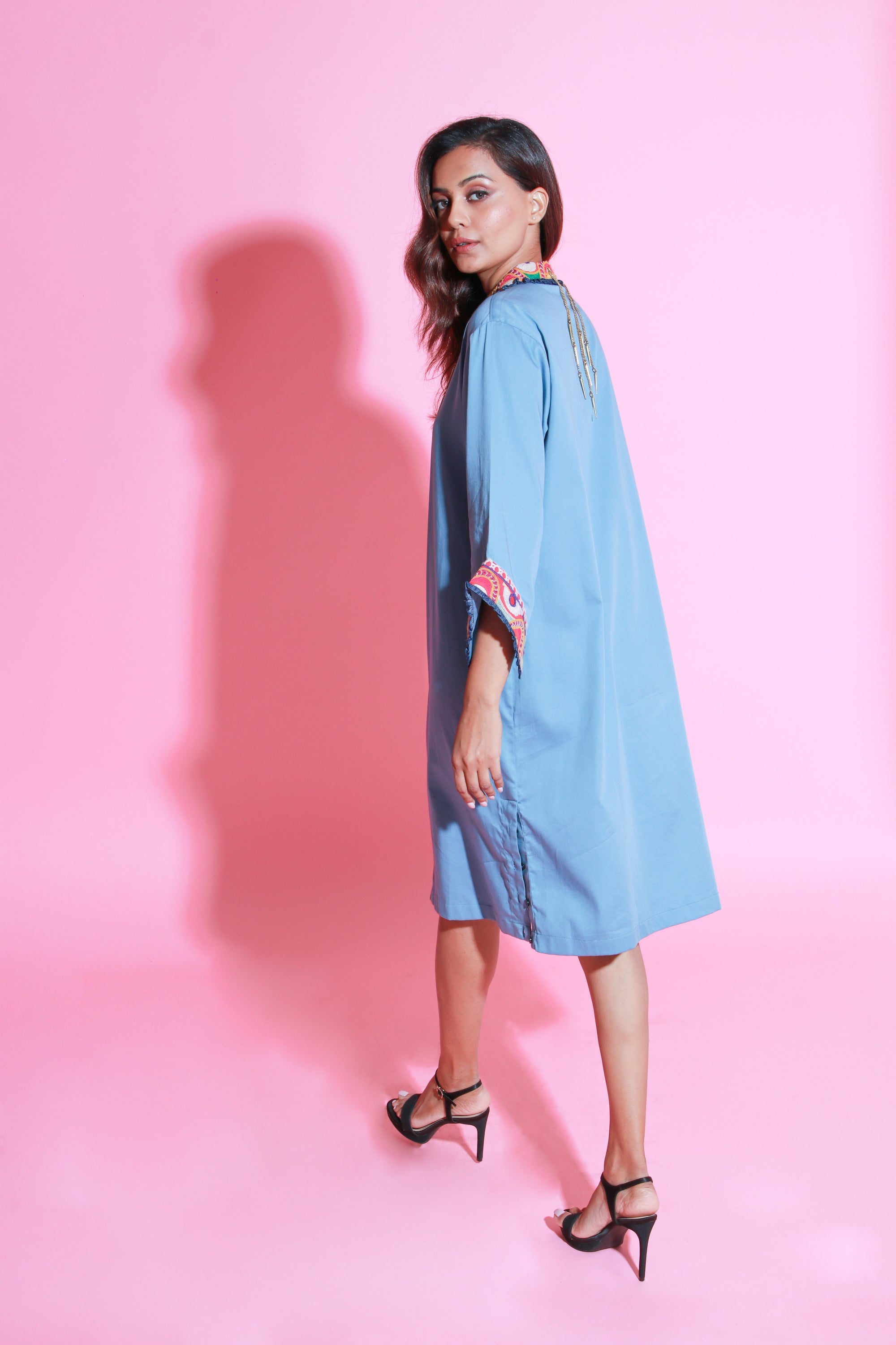Slate blue shirt dress with Kutch border and a mandarin collar with side buttons slit.