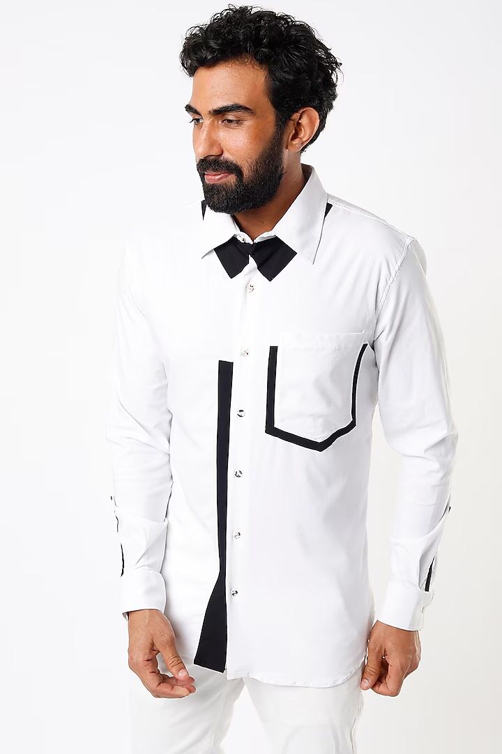 White shirt with black detailing below the collar, on placket, pocket and cuff slit