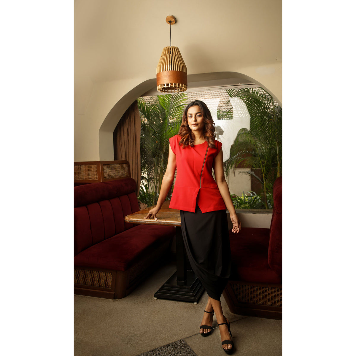 Black skirt features a cowl detailing and calf-length hem.