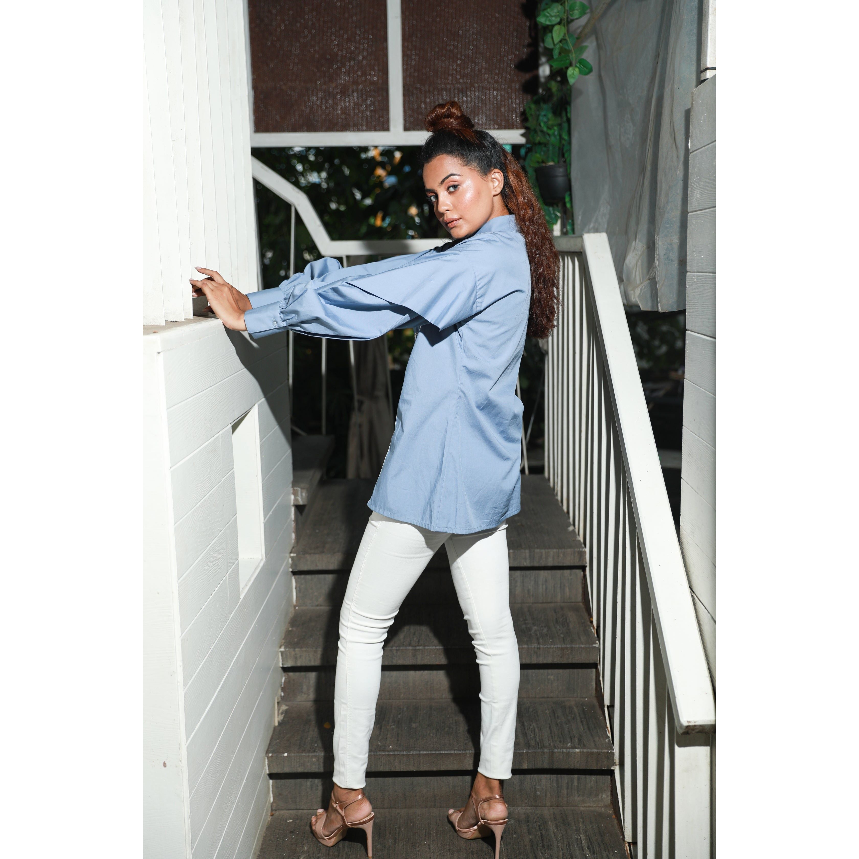 Slate blue wide collared shirt features white piping hook & eye with front dart.