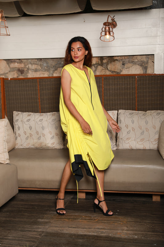 Asymmetric yellow sleeveless dress with one side ruching feature.