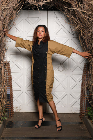 Two-toned  shirt dress features khaki and black vertical panels with cold shoulders.