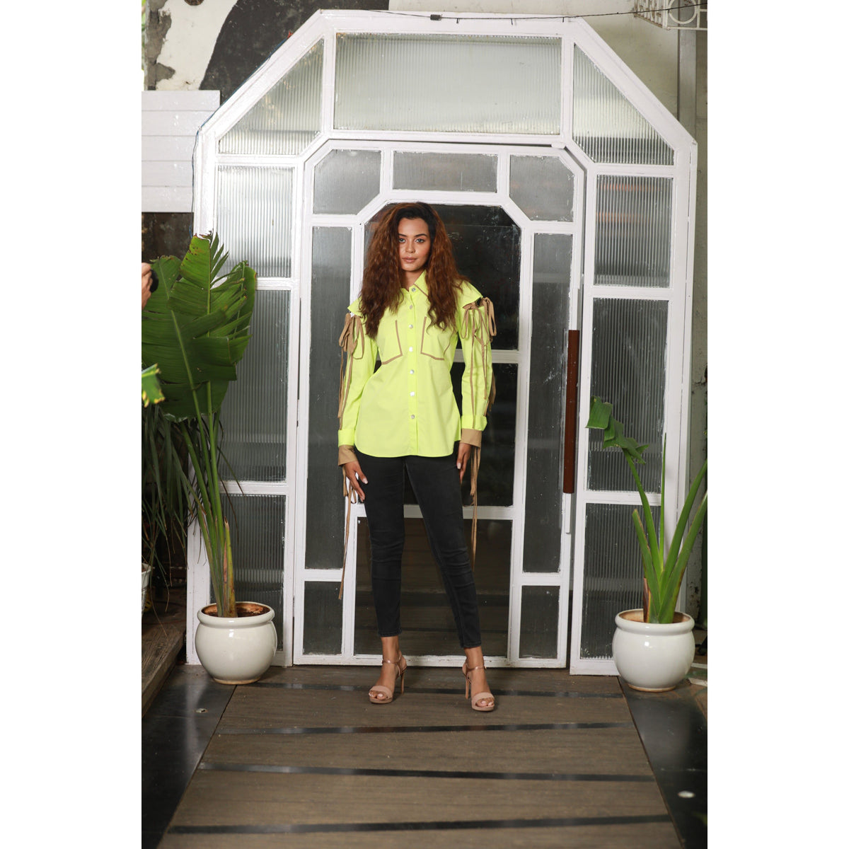 Lime green shirt features oversized pockets and sleeves with khaki tie-up detailing.