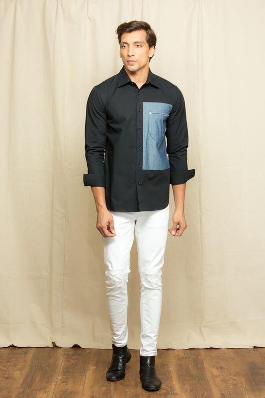 Black shirt with elongated denim patch feature.