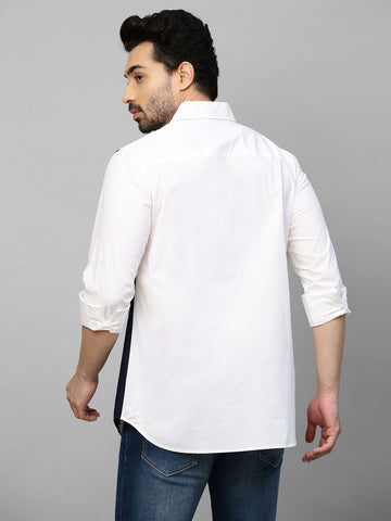 White shirt with color block patch detailing.