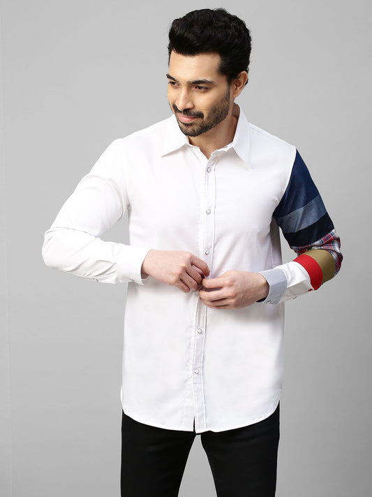 White shirt with patch detailing on one sleeve.