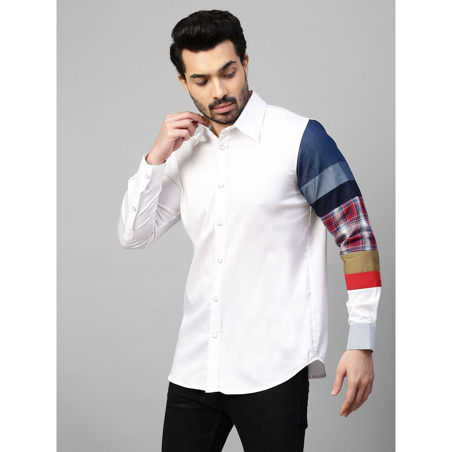 White shirt with patch detailing on one sleeve.