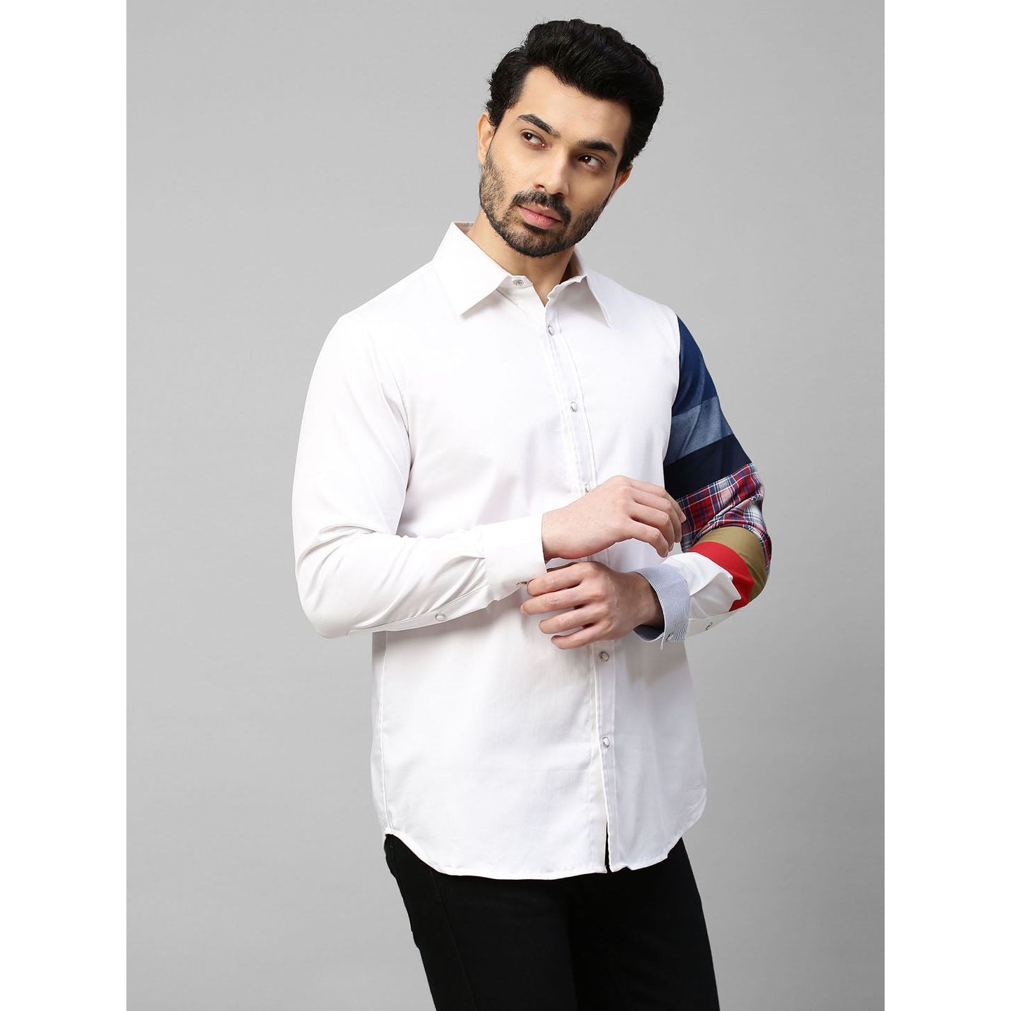 White shirt with patch detailing on one sleeve.