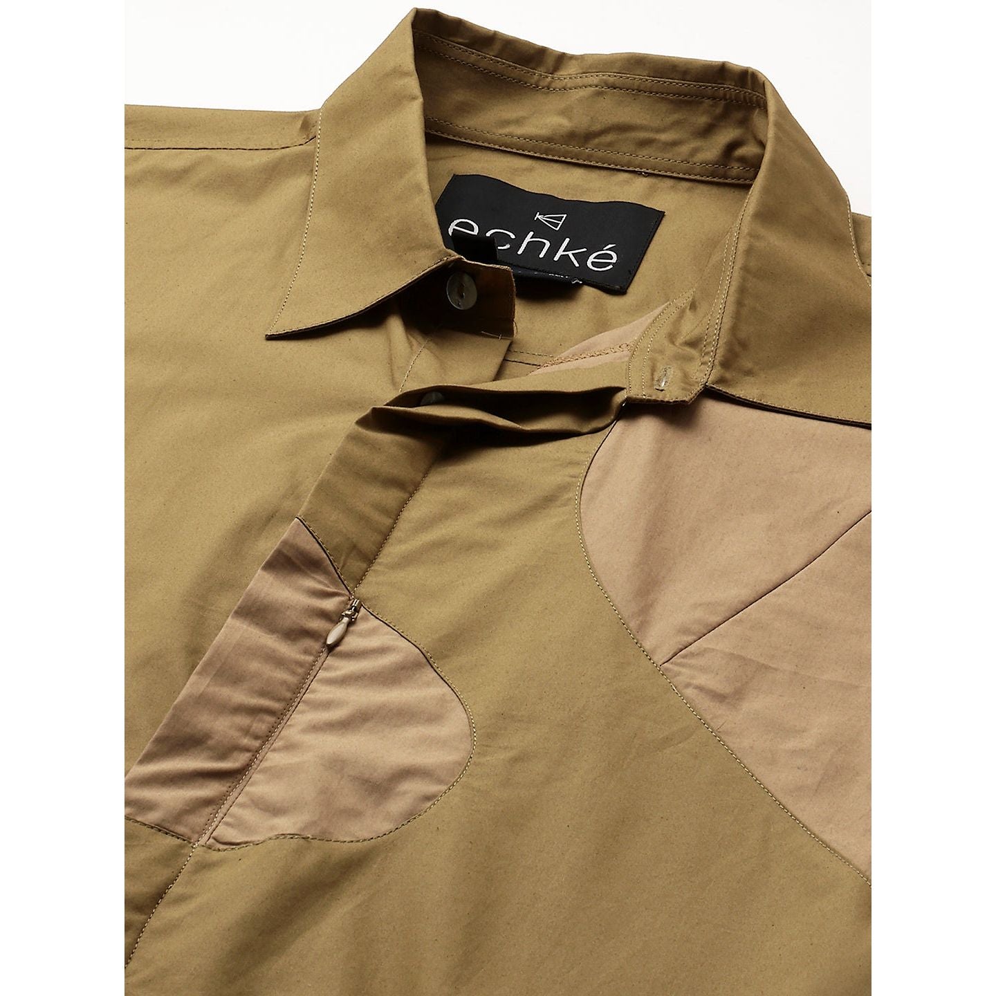 Shades khaki patch work shirt and concealed zipper feature.