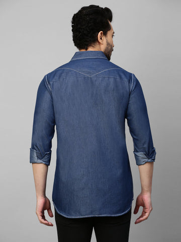 Denim shirt with contrast stitching feature.