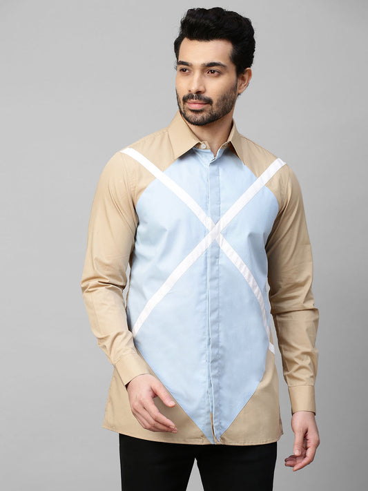 Beige shirt with light blue and white patchwork detailing.