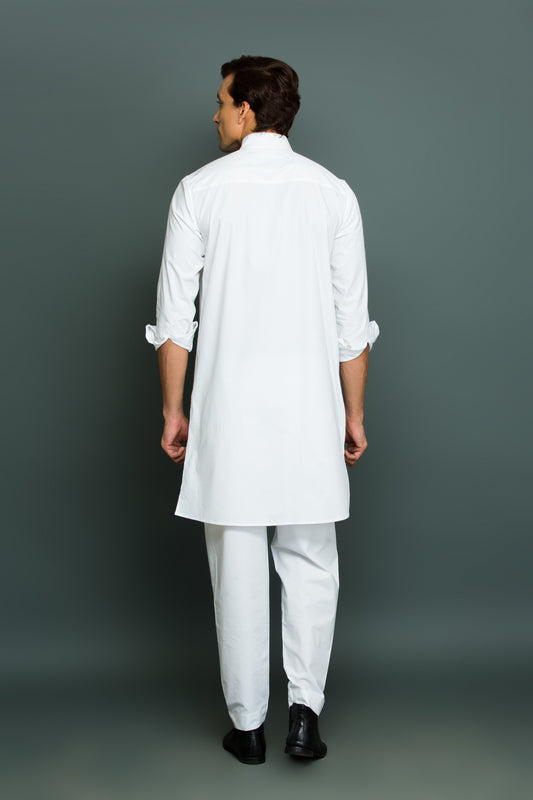 White kurta with front pleated panel and pocket with pants.