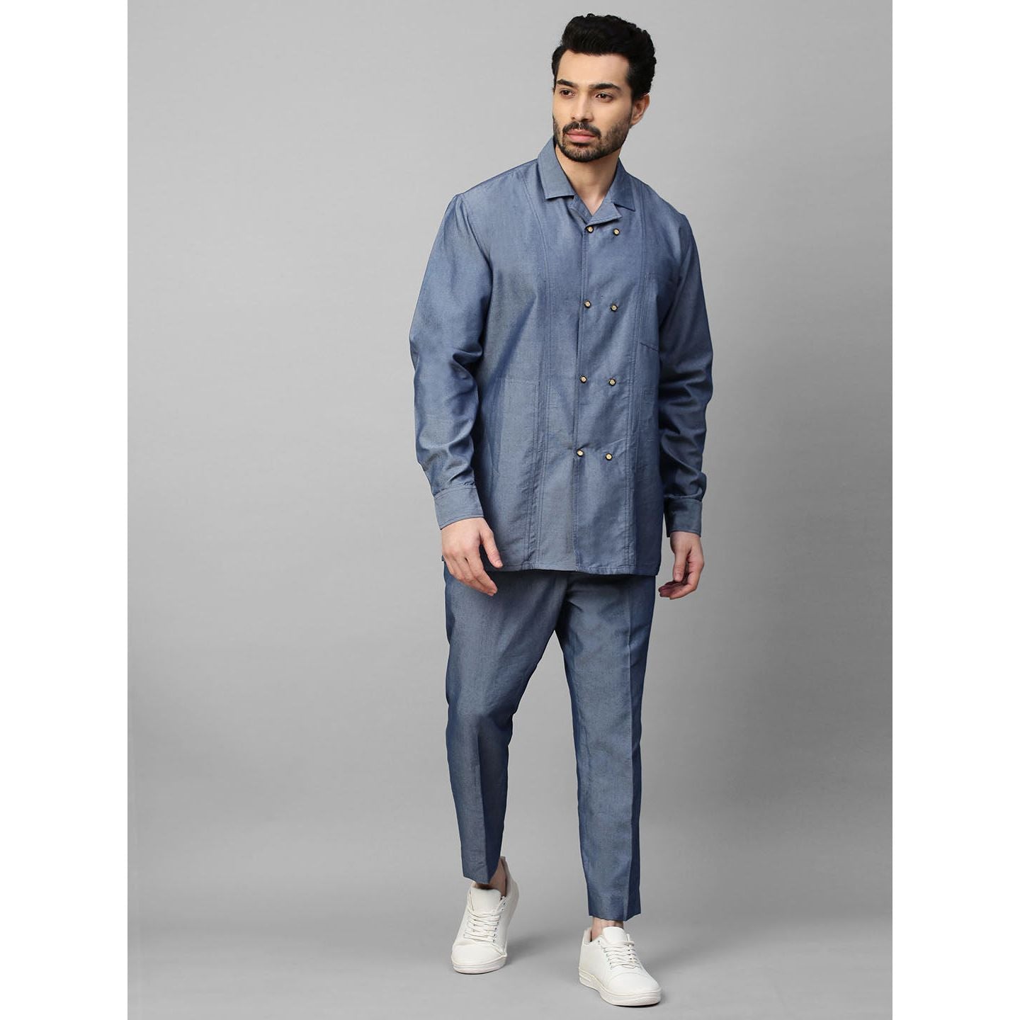 Light denim double breasted shirt with narrow pants.