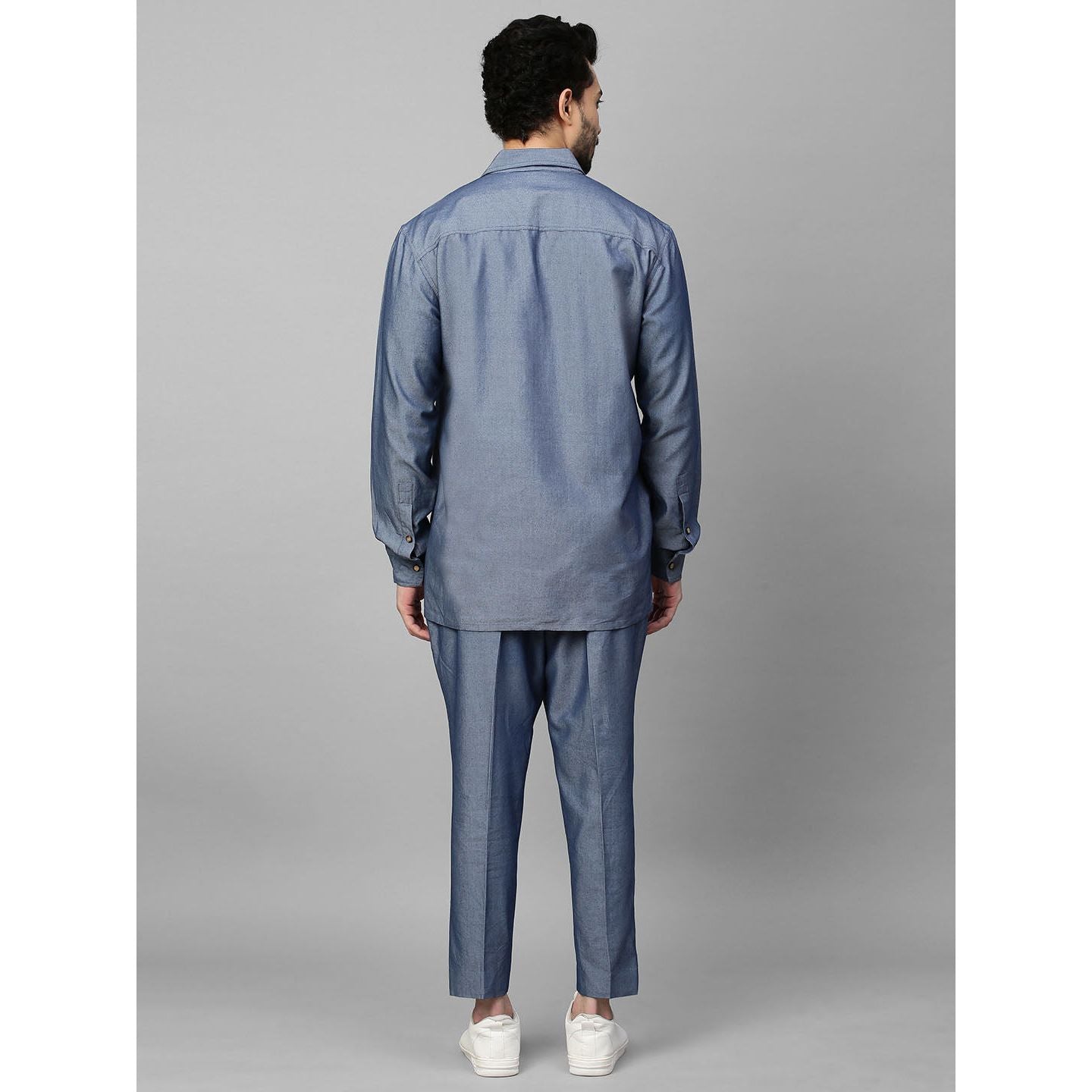 Light denim double breasted shirt with narrow pants.