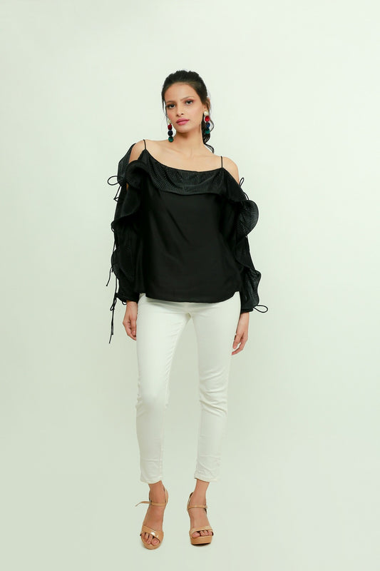 Black silk off-shoulder top features a pleated frill running across the sleeves.