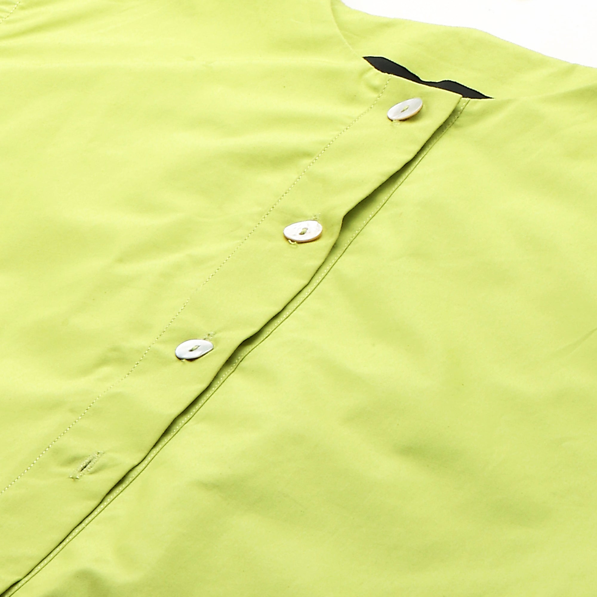 Lime green sleeveless shirt features a drape sleeve on one side.
