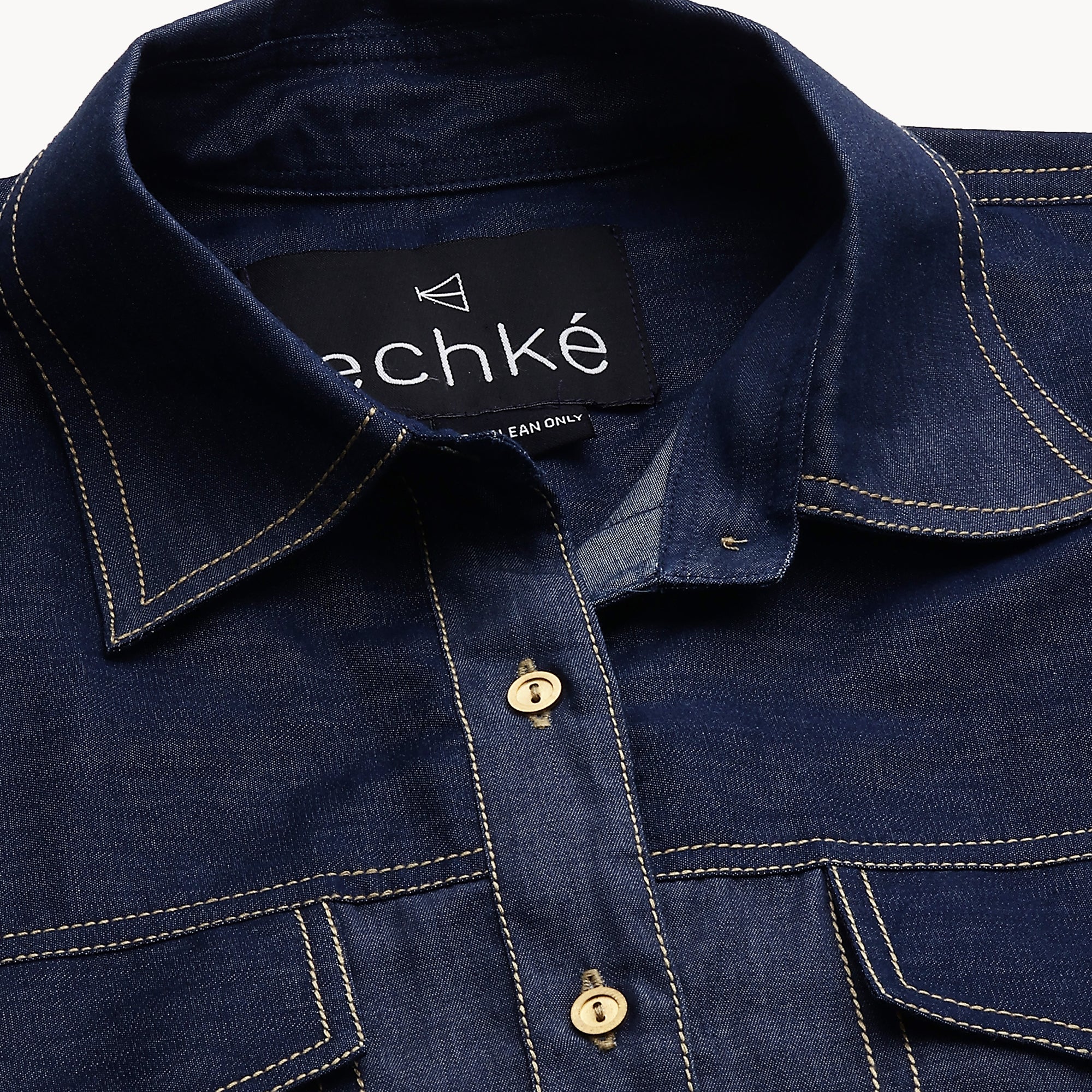 Denim button-down shirt features full sleeves and a red embellished cross.