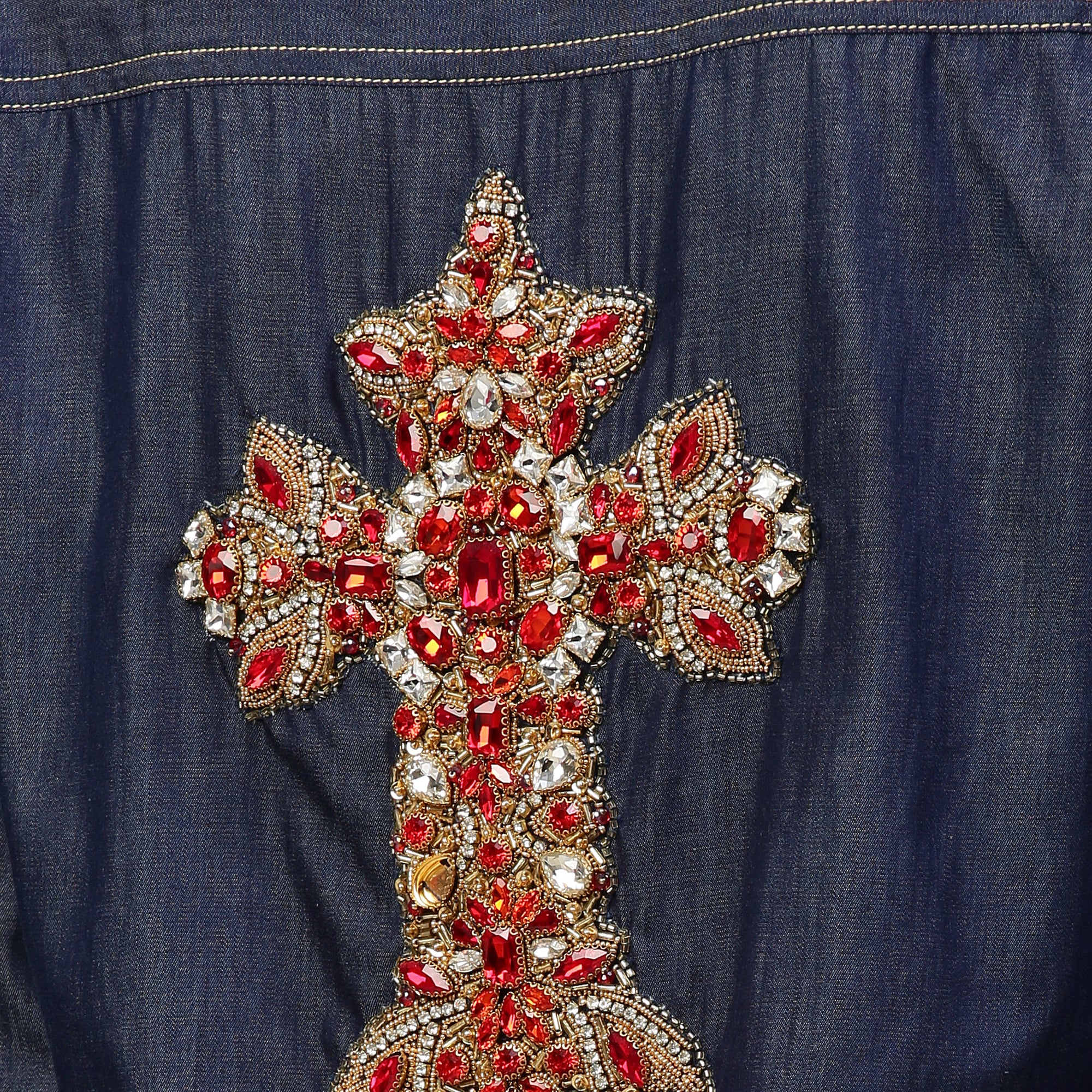 Denim button-down shirt features full sleeves and a red embellished cross.