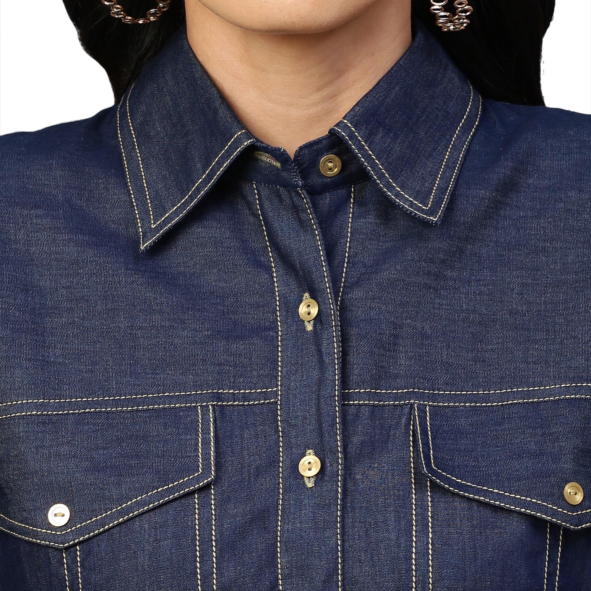 Denim button-down shirt features full sleeves and a red embellished cross.