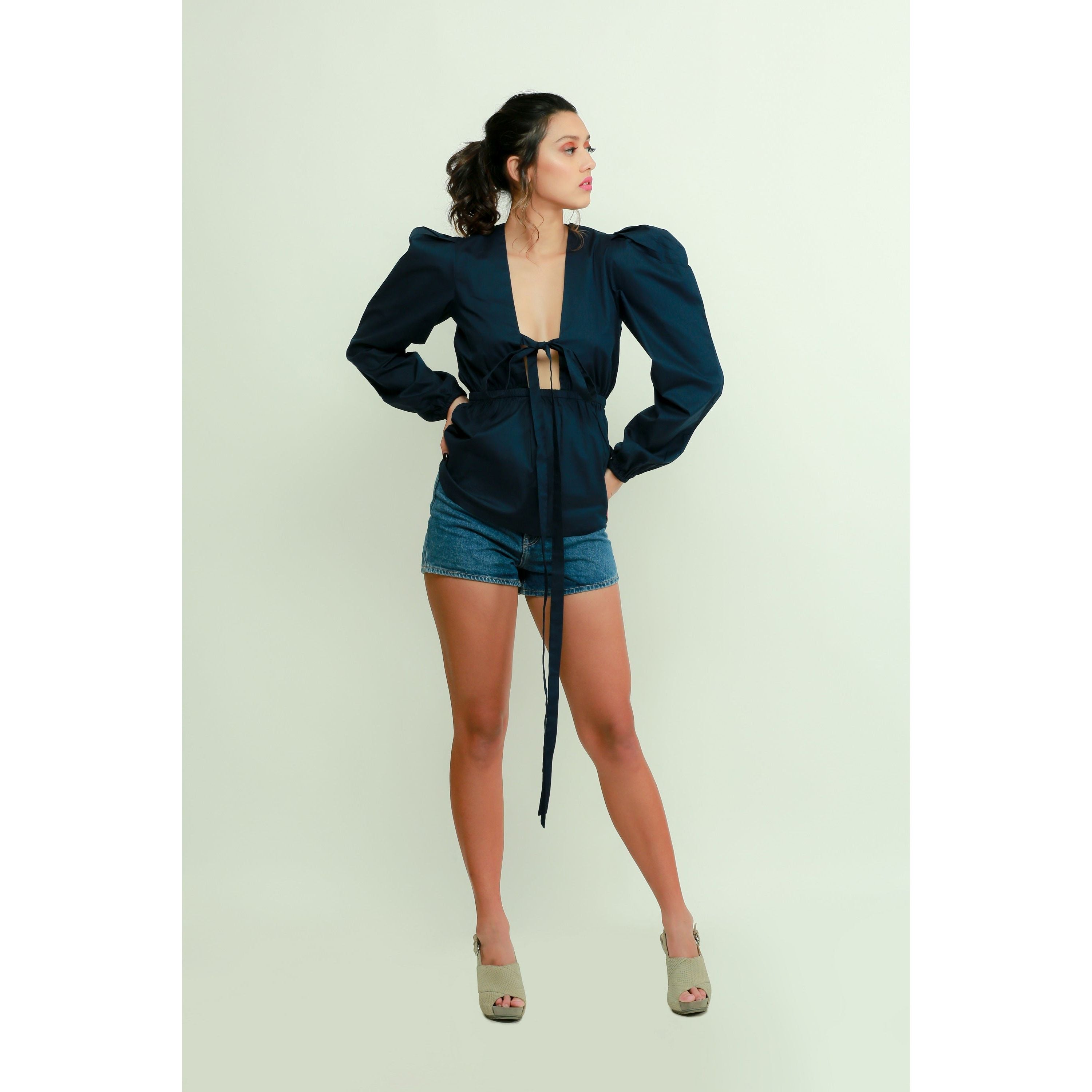Dark blue top features a tie-up detailing, balloon sleeves.
