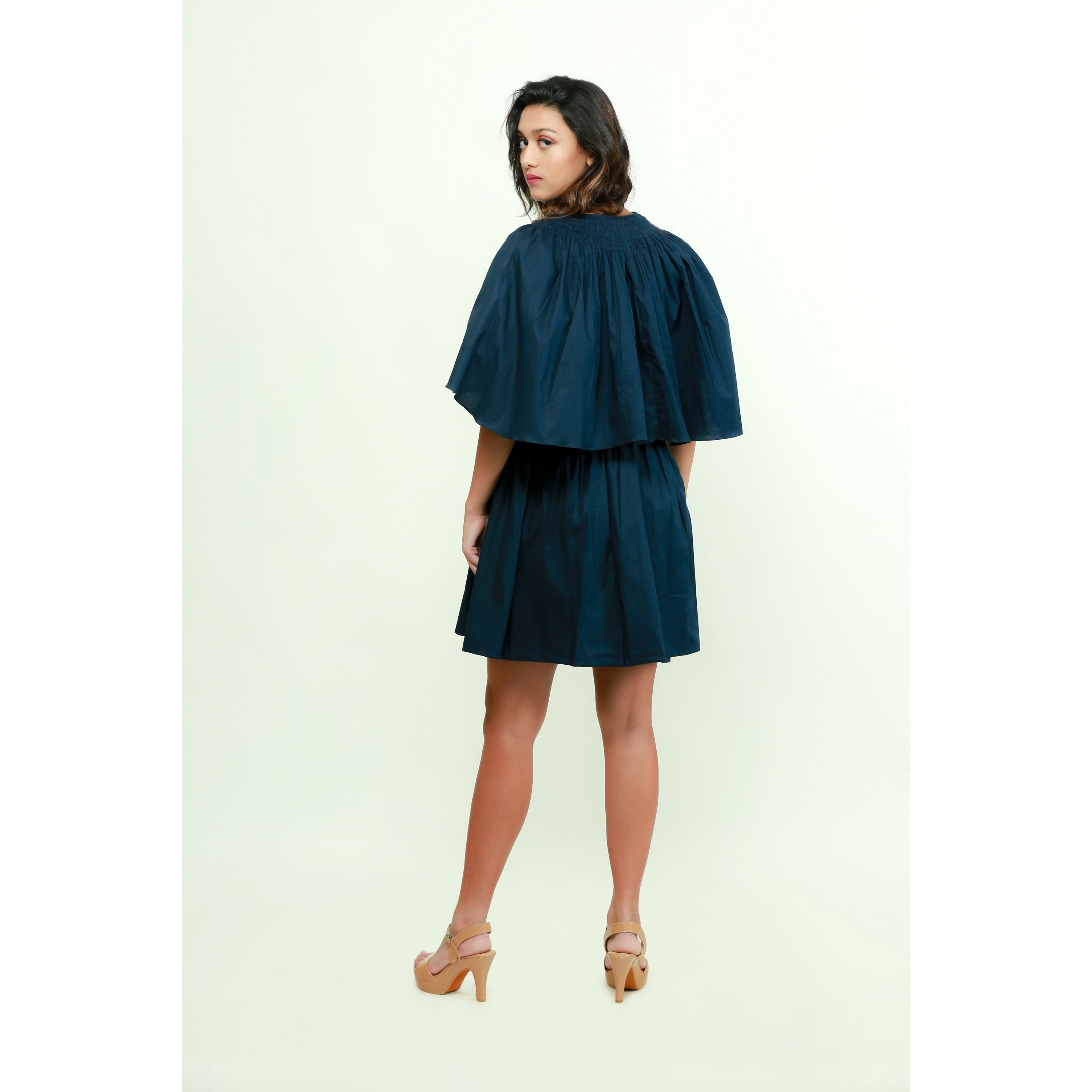 Dark blue skater dress features a plunging neckline and flared sleeves.
