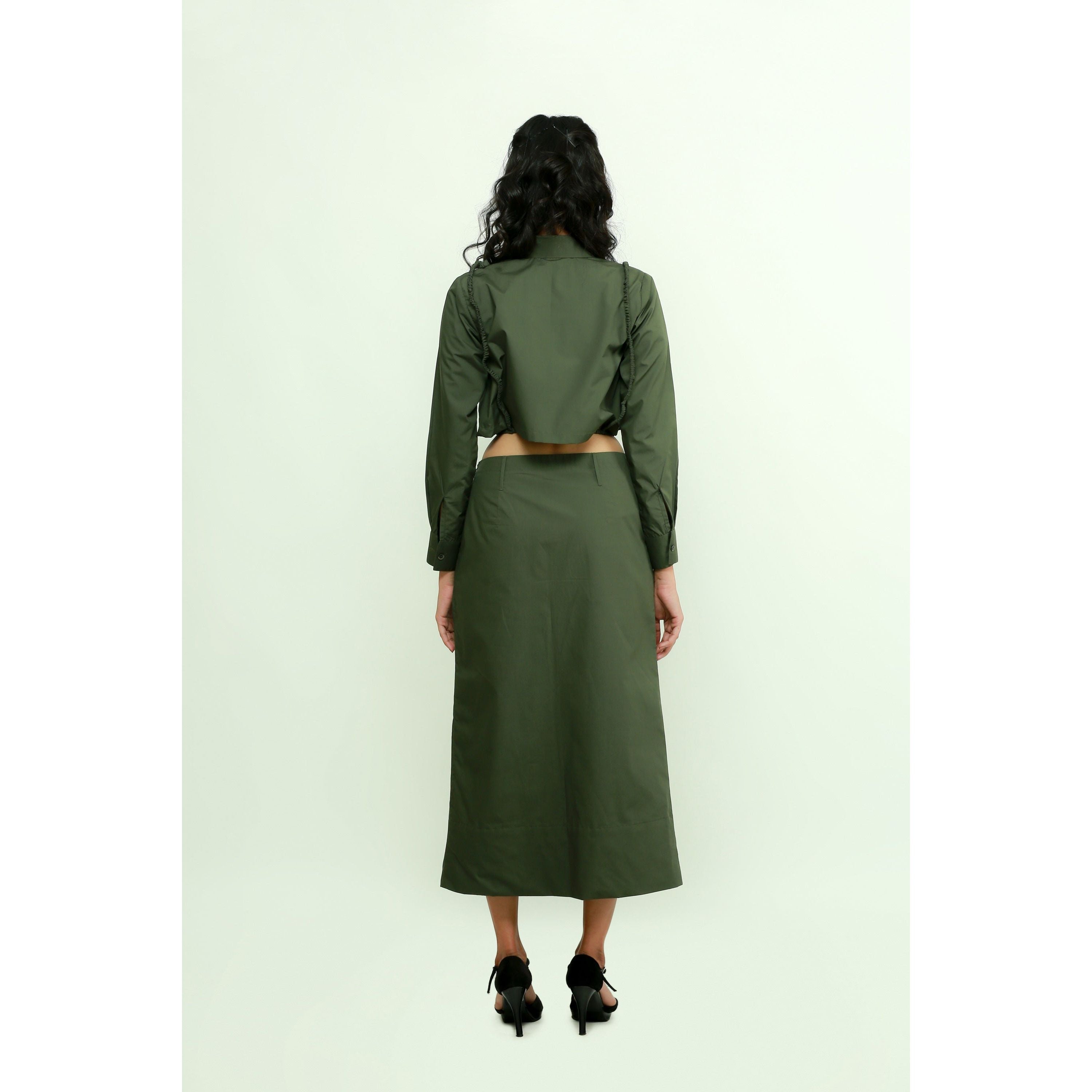 Military green co-ord set features a crop top with harness and a maxi skirt with front slit.