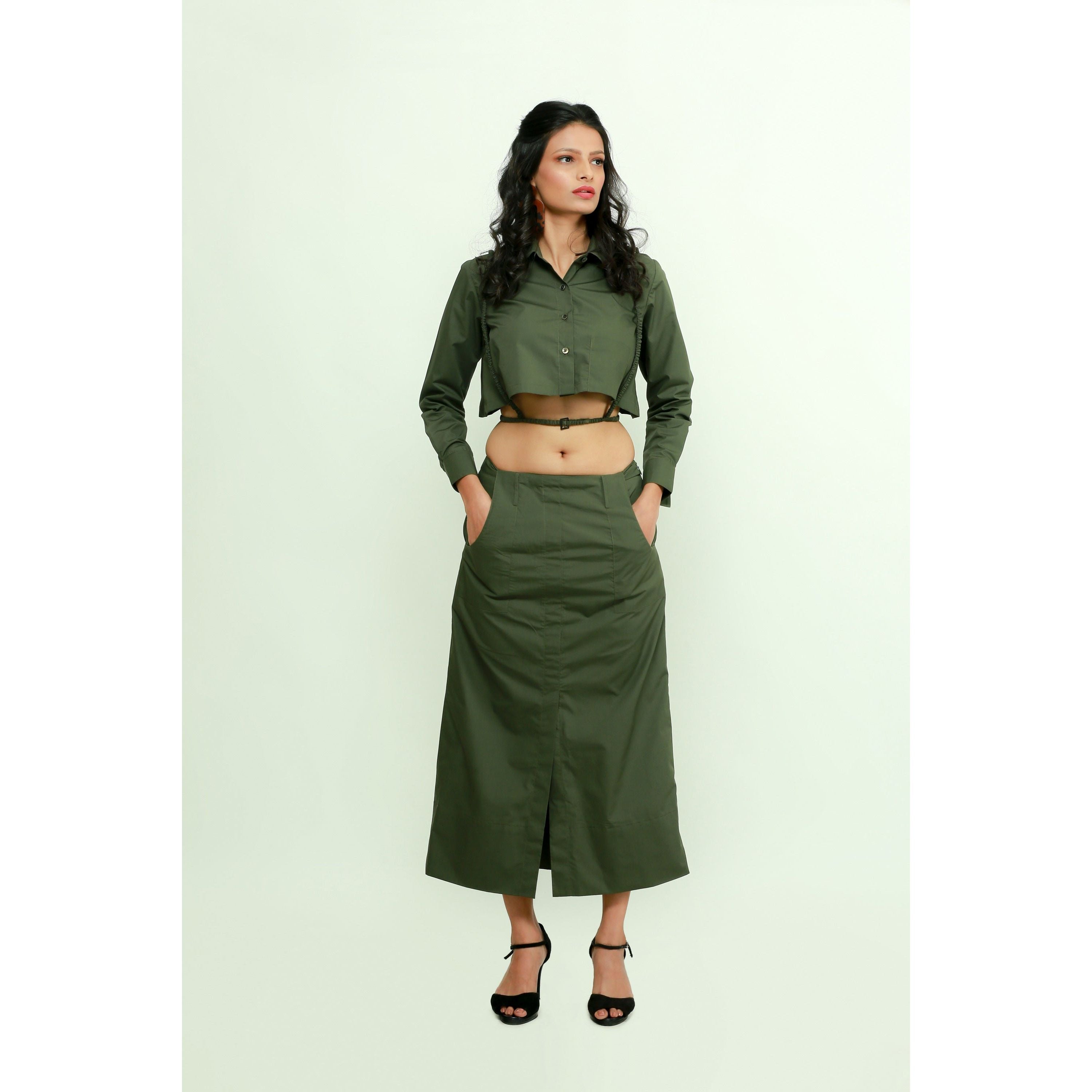 Military green co-ord set features a crop top with harness and a maxi skirt with front slit.
