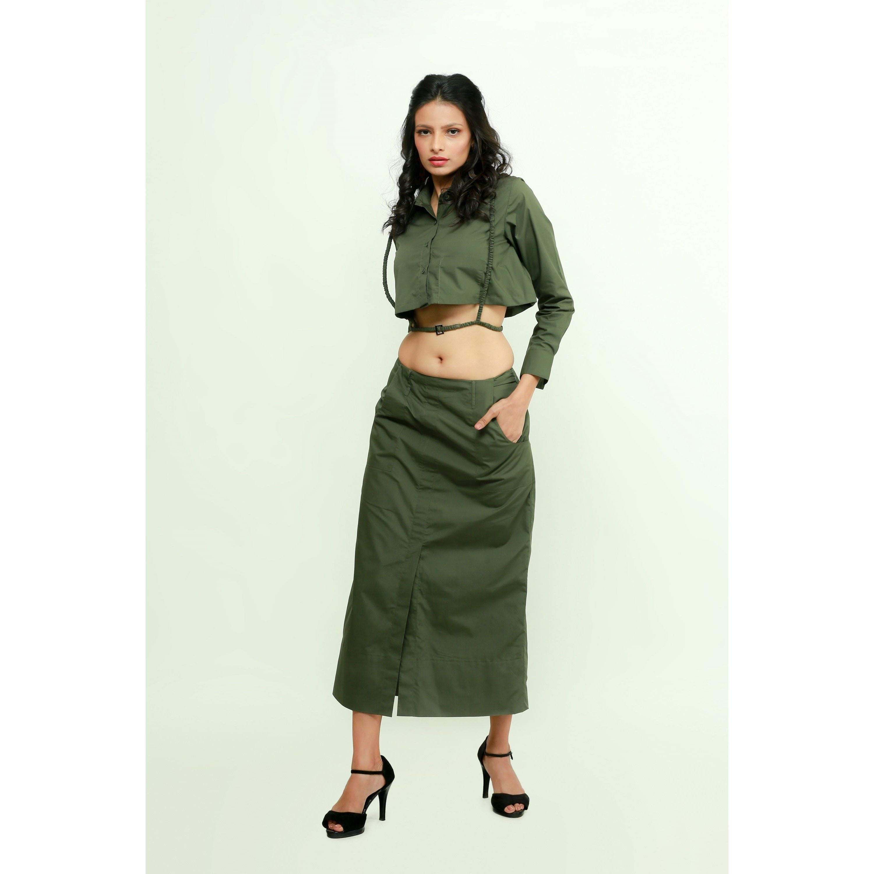Military green co-ord set features a crop top with harness and a maxi skirt with front slit.