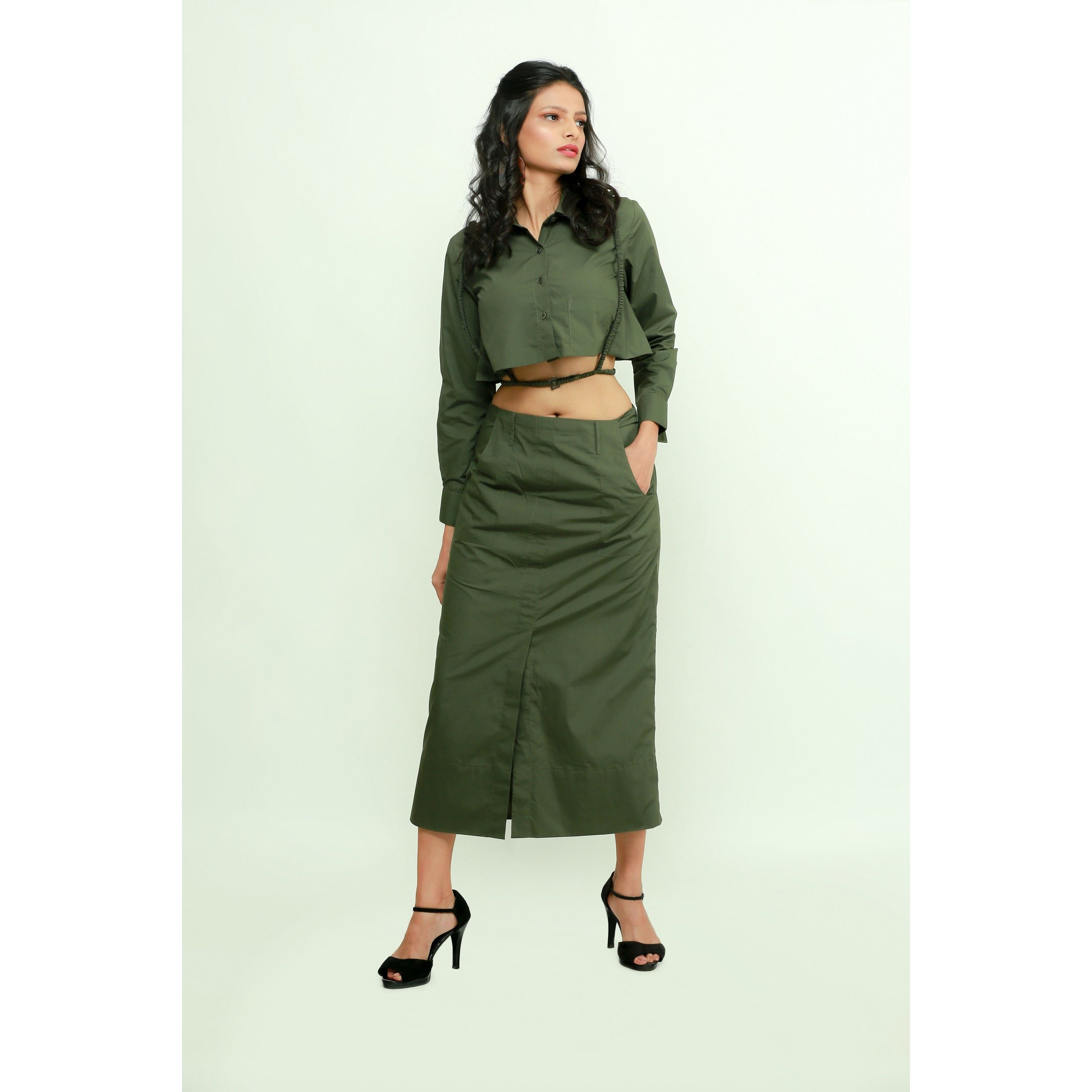 Military green co-ord set features a crop top with harness and a maxi skirt with front slit.