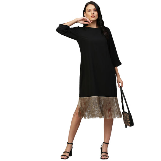 Black midi dress with tassel feature.