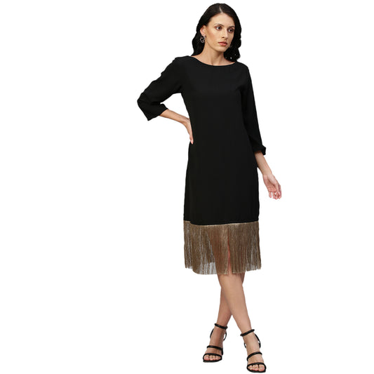 Black midi dress with tassel feature.