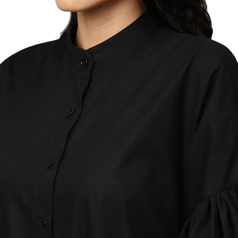 Black flare dress features bell sleeves, long & short hem and eyelet.