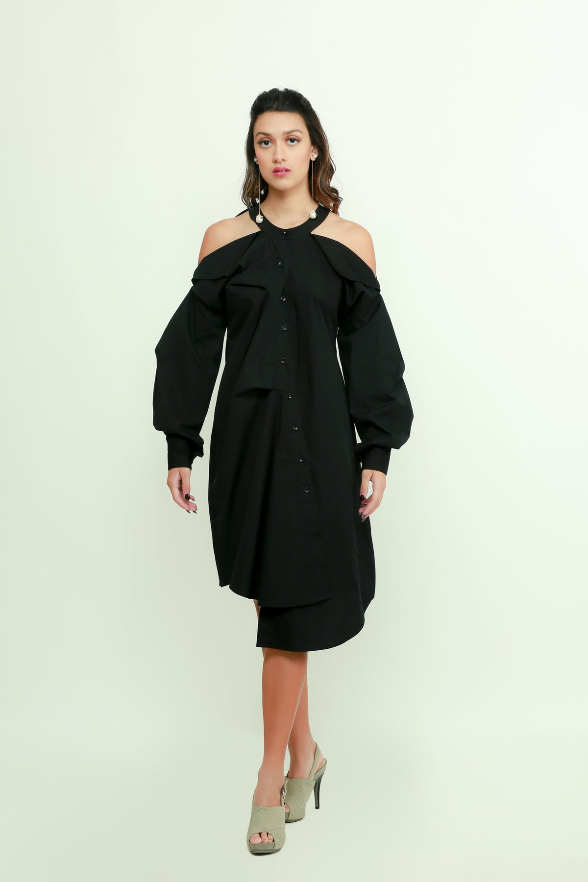 Black midi flap dress with pleated sleeves and an asymmetric placket detailing.