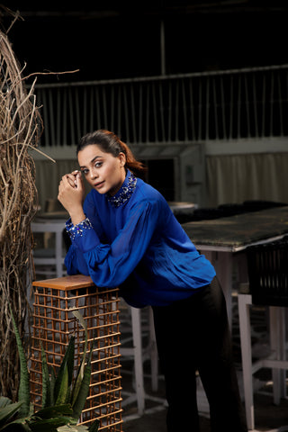 Blue embellished top features a chinese collar with balloon sleeves.