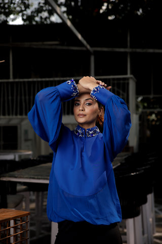 Blue embellished top features a chinese collar with balloon sleeves.