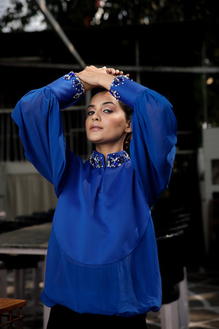 Blue embellished top features a chinese collar with balloon sleeves.